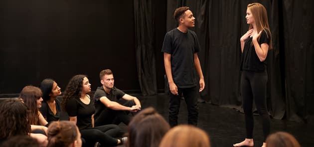 group of teenagers dressed in black at a