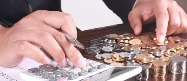 close up on hands counting money with pe