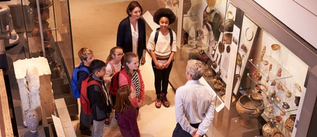 school children and teacher being shown 
